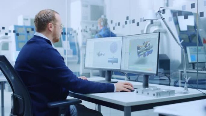 解决问题的男性工业工程师，在个人计算机上工作，两个监视器屏幕显示cad软件与混合动力发动机的3D原型