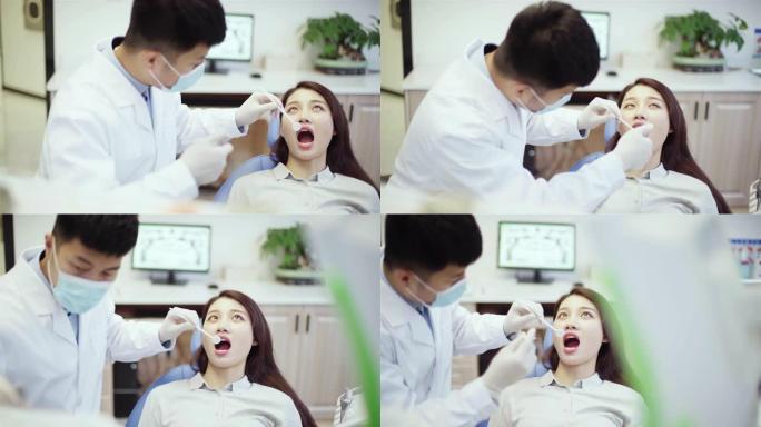 牙医在牙科诊所检查病人