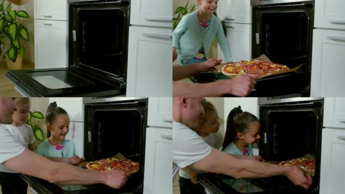 父亲和女儿将比萨饼放入烤箱