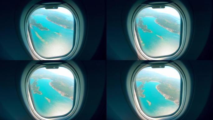 从飞机窗口显示的岛屿和大海