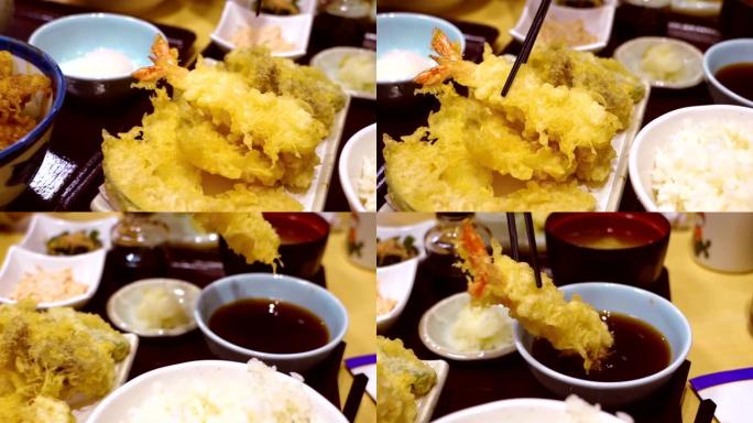慢动作用筷子吃天妇罗虾，日本。