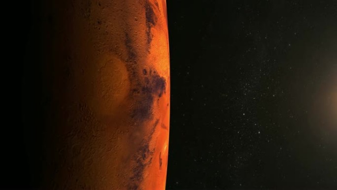 来自太空的火星。星星闪烁。飞越火星。4K。火星在屏幕的左侧，并缓慢旋转。摄像机向前移动。