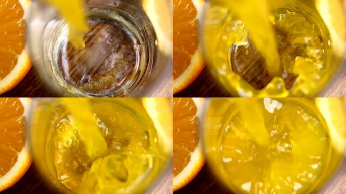 新鲜的橙子果汁into glass cup