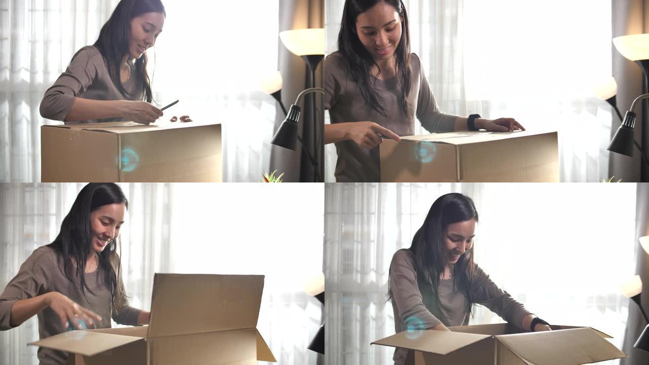 亚洲女性在家网上购物打开盒子
