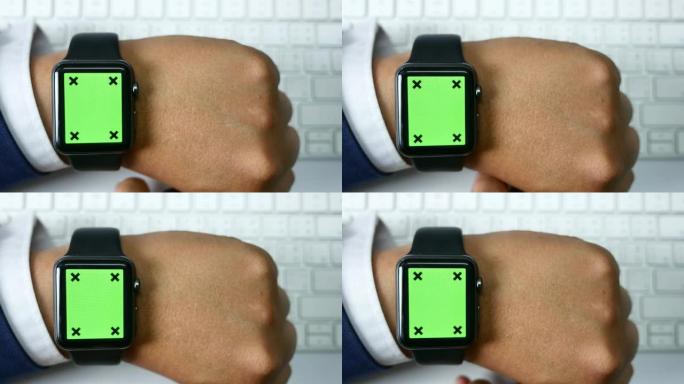 商人使用绿屏智能手表