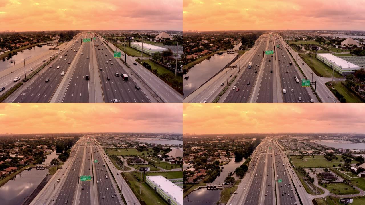 美国佛罗里达州迈阿密日落时，WS风景鸟瞰车沿着高速公路行驶