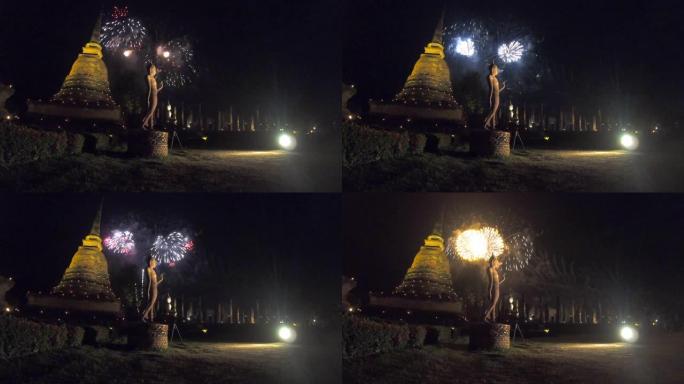 泰国素可泰历史公园令人惊叹的Loi Kra Tong节中的佛像站立和烟花