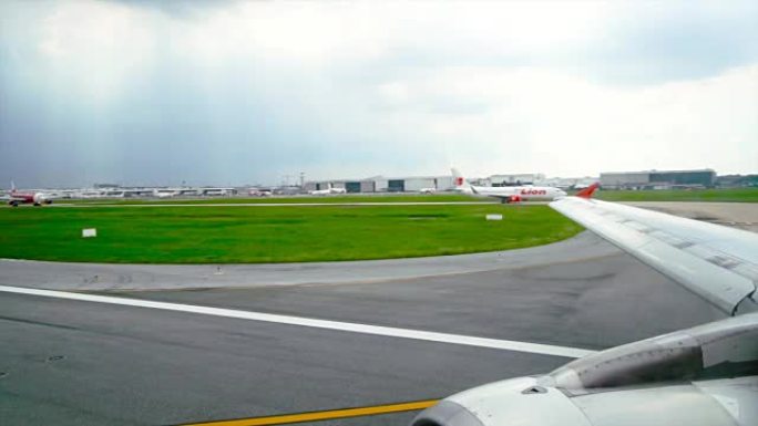 机场起飞前在跑道上飞行的4k慢动作镜头，旅行和运输概念