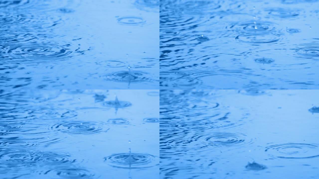 雨水溅到水面特写雨水溅到水面特写波纹