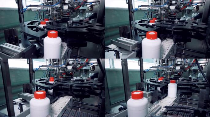 白色塑料罐正在用盖子机械封闭