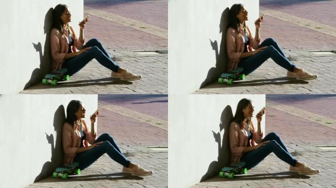 女人在阳光明媚的日子里用手机聊天4k