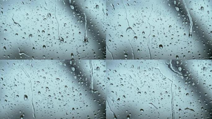 大雨时侧窗上的雨滴。慢动作镜头