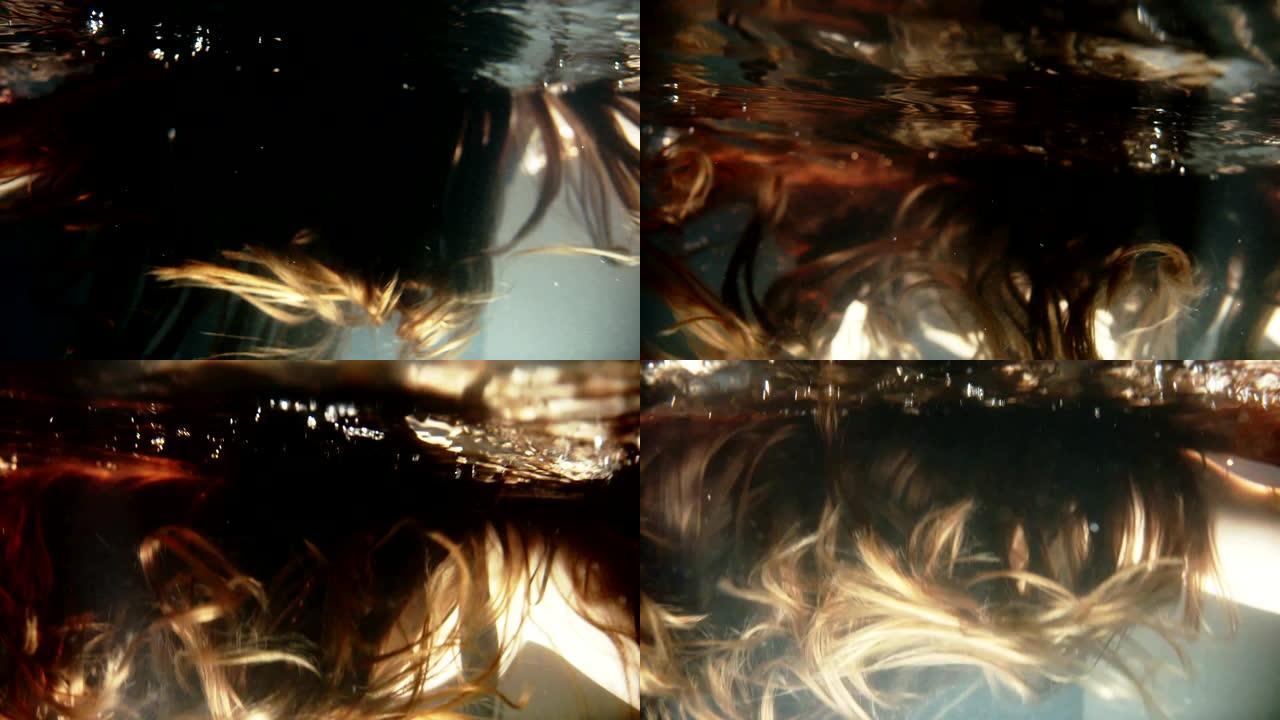 光线在水下闪亮的棕色头发上移动