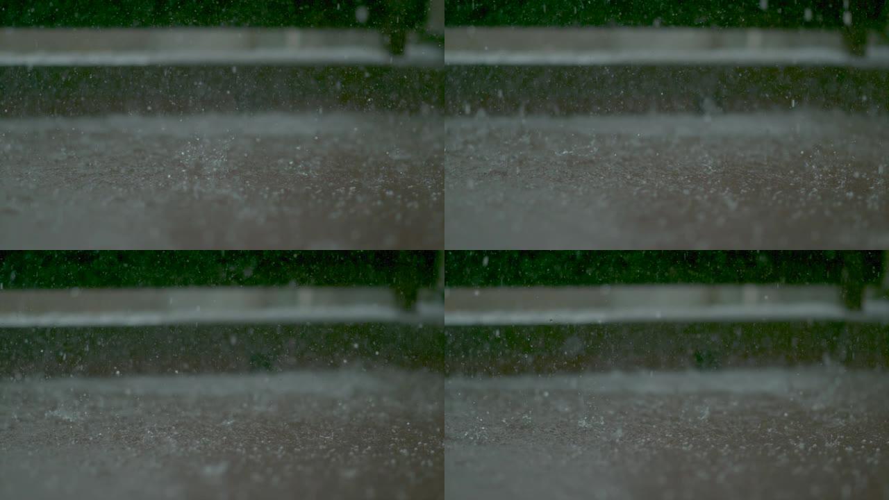 宏观，dop: 雨滴落入阳台地板上形成的小水坑中