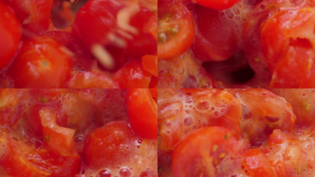 搅拌机里的西红柿块。慢动作。特写镜头。