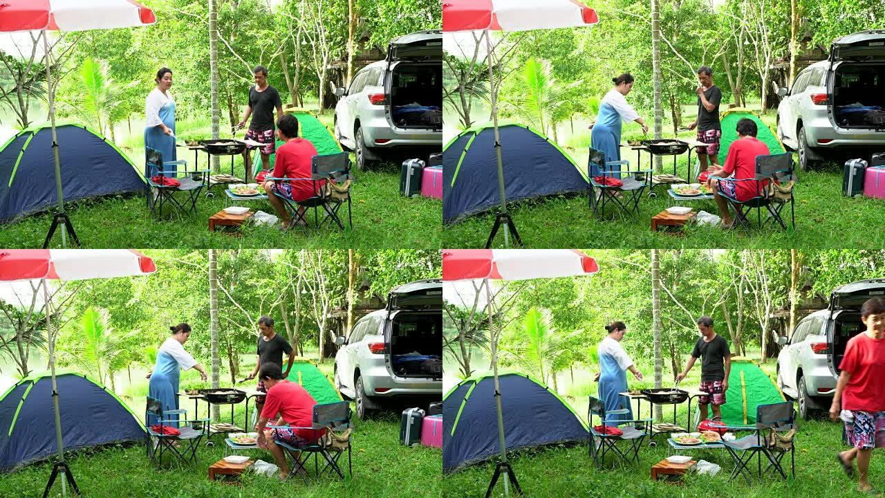 一家人开车旅行，在度假时露营，在帐篷里休息，在森林里烤海鲜。