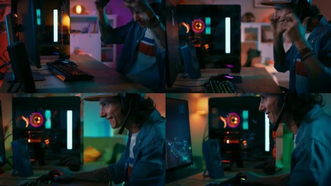Gamer戴上麦克风的耳机，然后开始在他的个人计算机上玩射击游戏在线视频游戏。房间和电脑有彩色霓虹灯