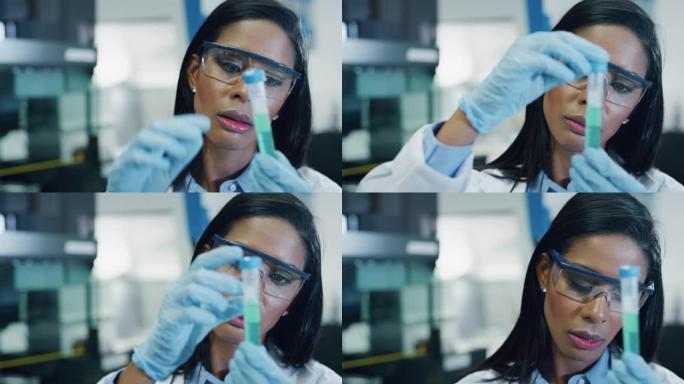 深色皮肤的肖像女科学家正在分析一种液体，以提取实验室试管中的DNA和分子