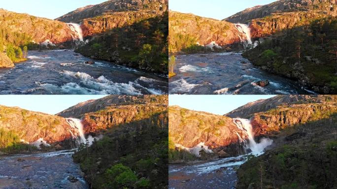 挪威的性质。山石、瀑布、山溪、常绿乔木。摄像机沿着河移动。空中射击，UHD