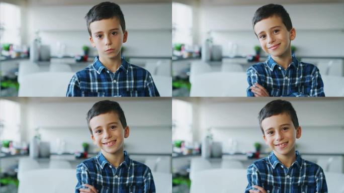 一个棕色眼睛的小男孩在厨房背景下看着相机的肖像。