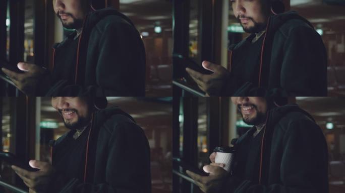 时髦的人使用社交媒体和智能手机，并在机场拿着咖啡杯。