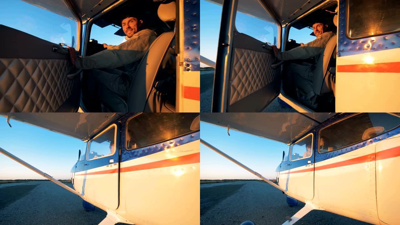 一个人坐在轻型飞机的驾驶舱里，特写镜头。