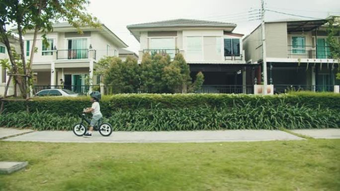 骑自行车的小男孩遛娃小区环境别墅区
