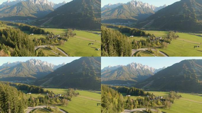 空中: 在落基山下的乡村道路和牧场的电影拍摄。