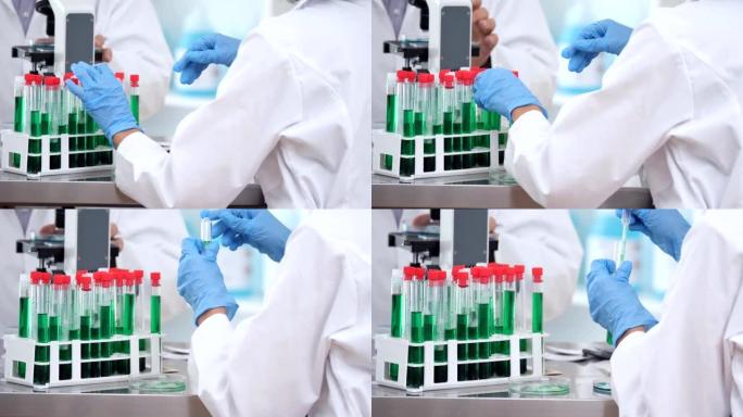 女科学家在实验室中使用移液器