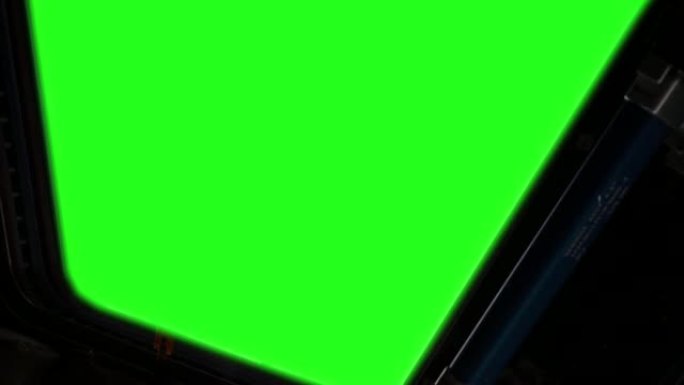 (ISS) 带有绿屏的国际空间站窗口。