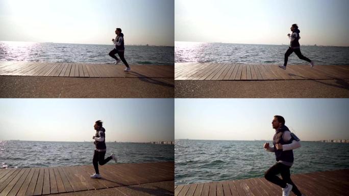 男子在海边慢跑晨跑海边跑步锻炼自由