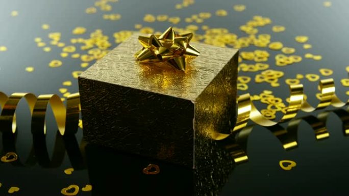 黑色表面4k金色礼品盒、彩带和心形五彩纸屑