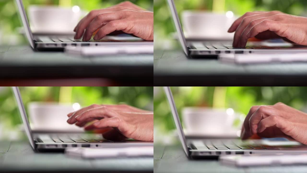 提升看到自由职业者的女性手在笔记本电脑上打字，按下按钮。在家工作，编码软件和在线交流。4K