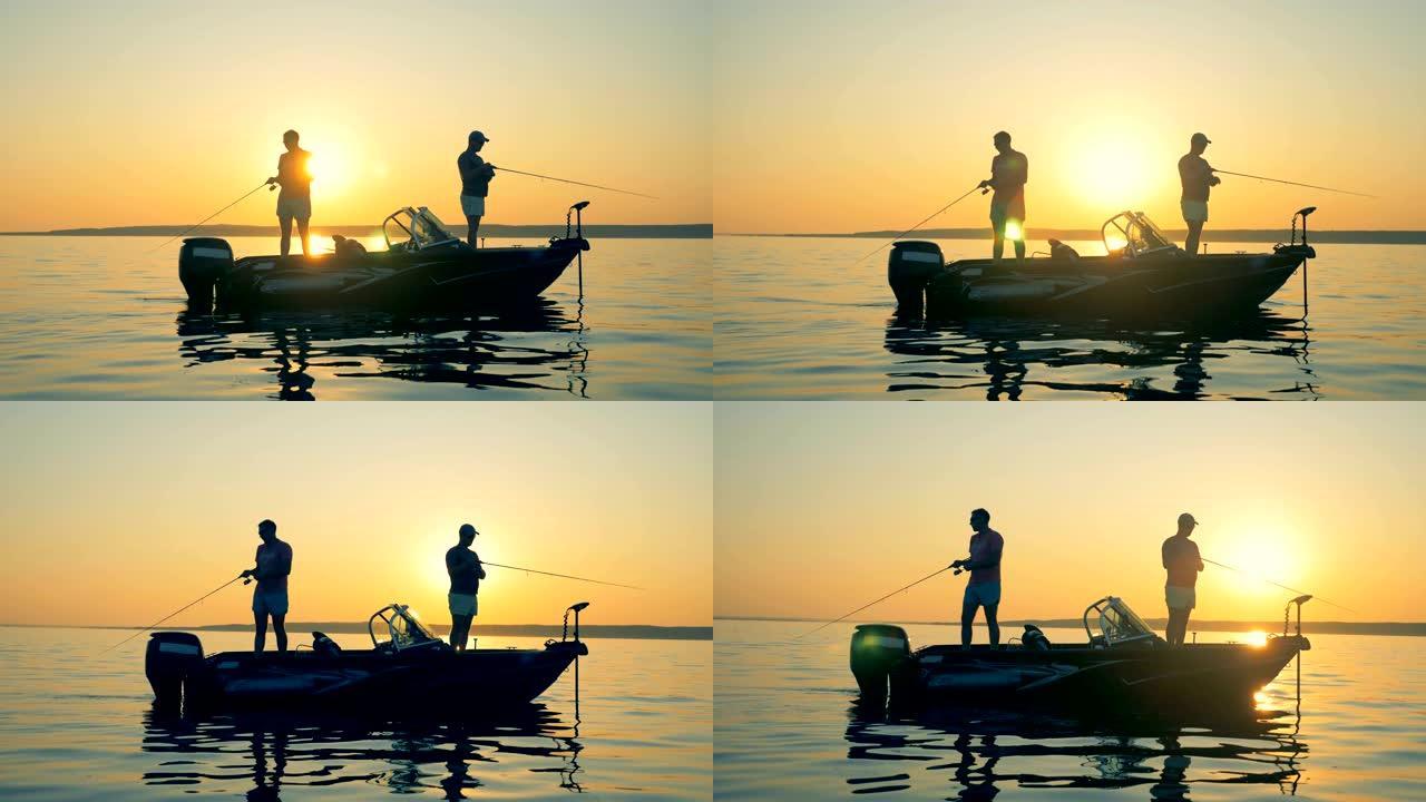 人们在日落背景下钓鱼，特写。