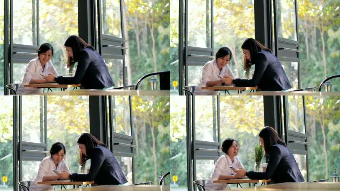 两个女人在咖啡馆谈论工作，慢动作