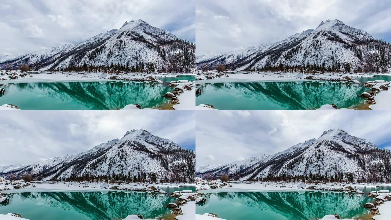 西藏的湖山积雪雪林雪景冰天雪地