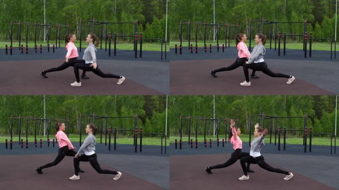 高加索女性双胞胎在公园向前冲刺