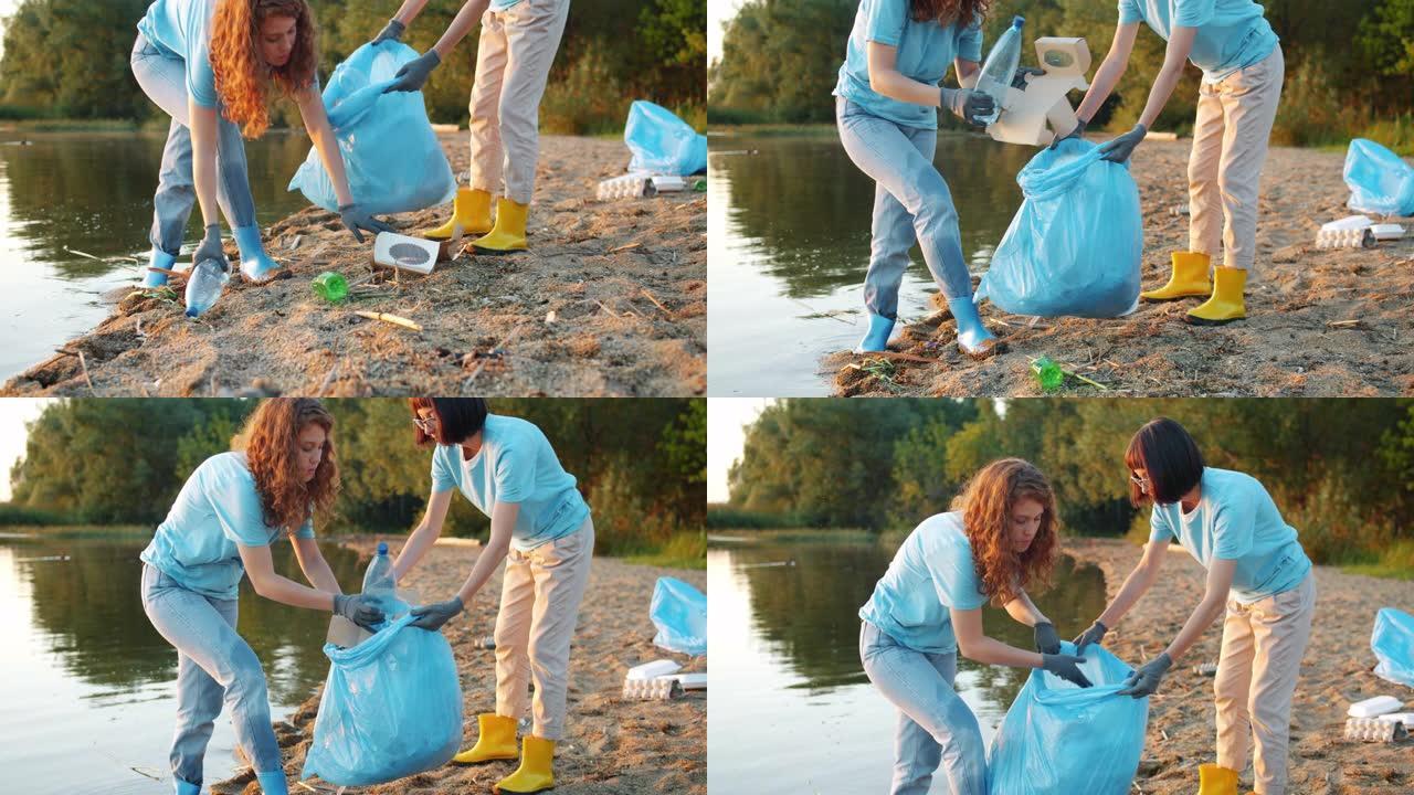两名女性生态活动家一起在海滩上捡垃圾