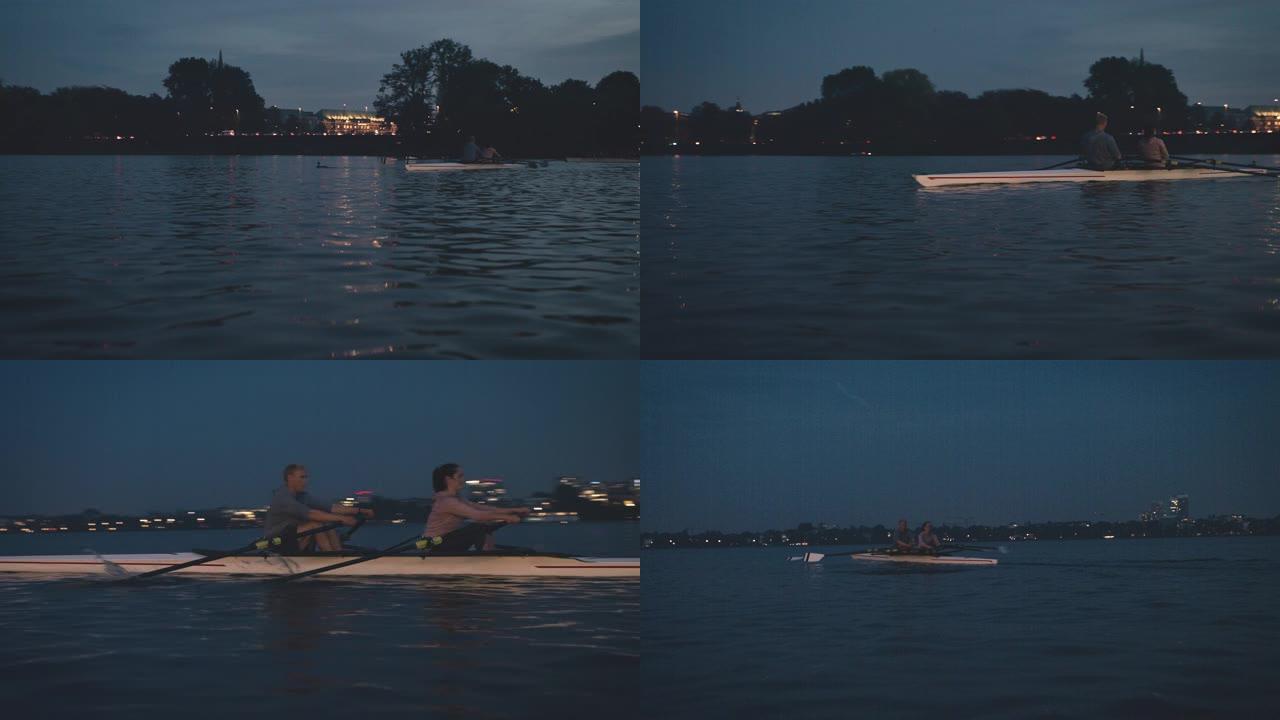 运动员在夜间在河中划桨船