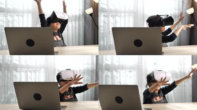 儿童在家里的笔记本电脑上使用虚拟现实模拟器眼镜