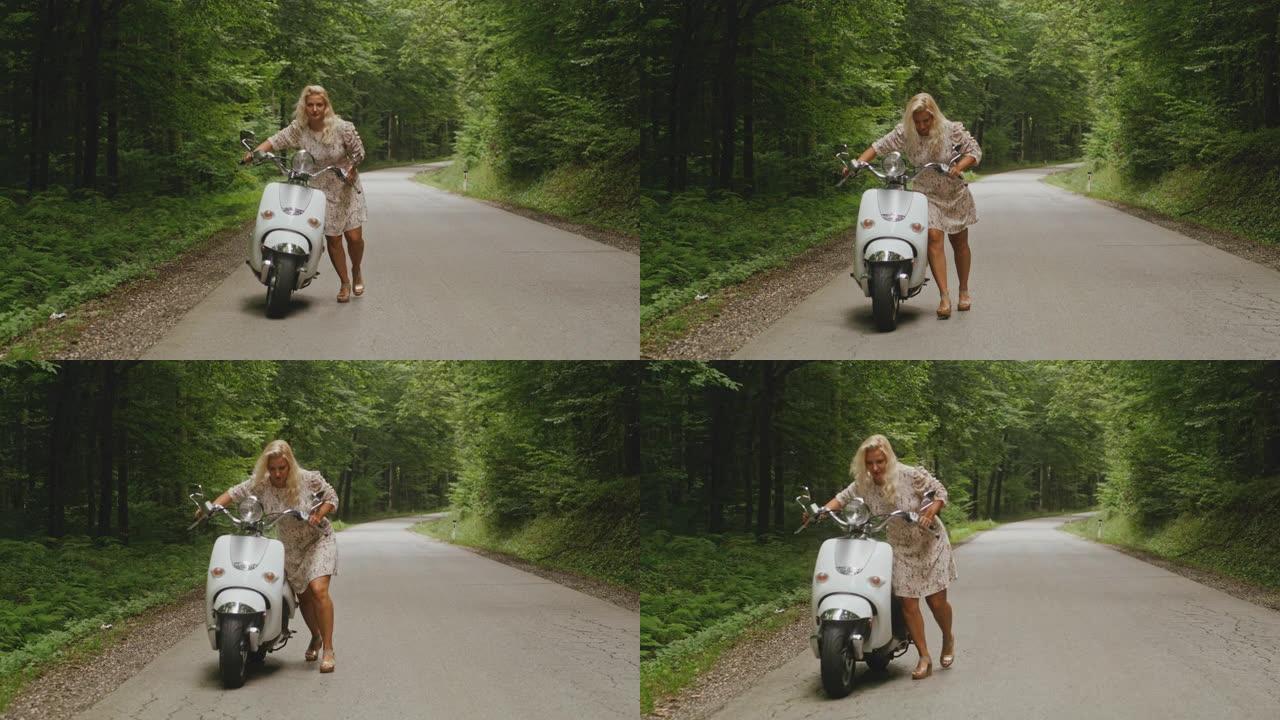 WS女人在穿过森林的道路上推踏板车