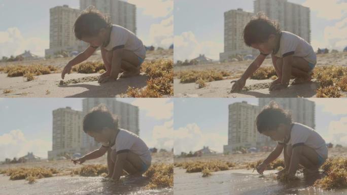 孩子在海滩玩得开心。-