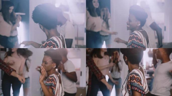 特写镜头后视图快乐的年轻非洲女人在多民族派对上与朋友跳舞。活力和能量慢动作。