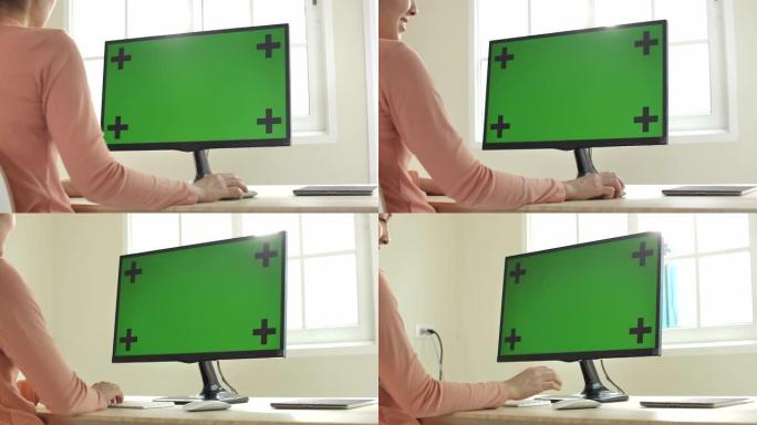 女人使用电脑绿屏制作