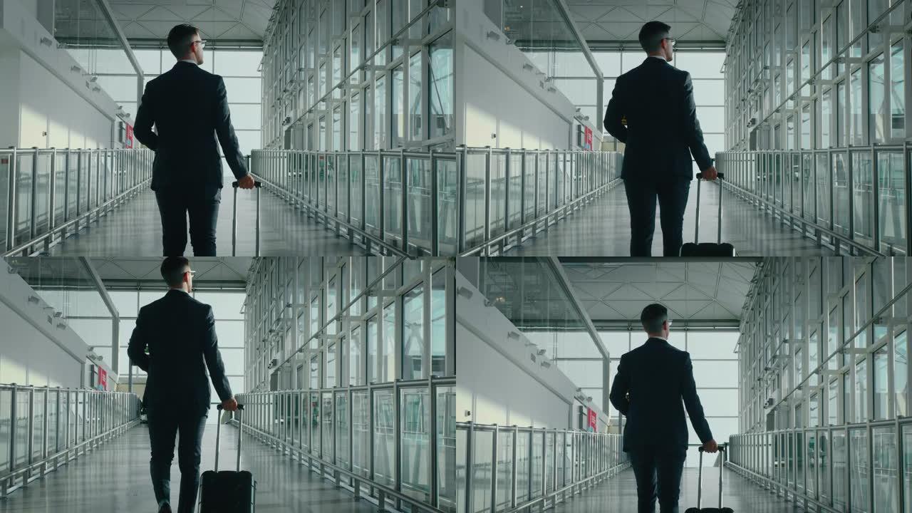 一位穿着西装的年轻优雅商人的慢动作正带着行李箱在国际机场里散步，窗外有阳光。