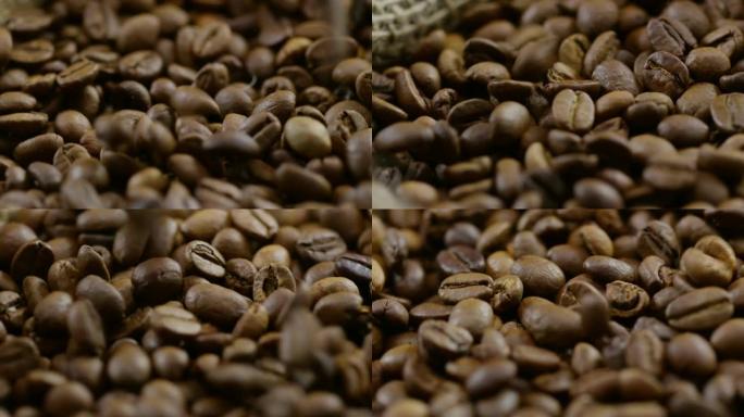 烤咖啡豆的特写咖啡豆掉落咖啡原材料手磨咖