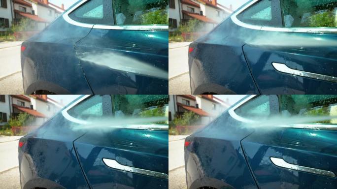 特写: 水滴在晴天被洗的蓝色汽车的侧面滑动