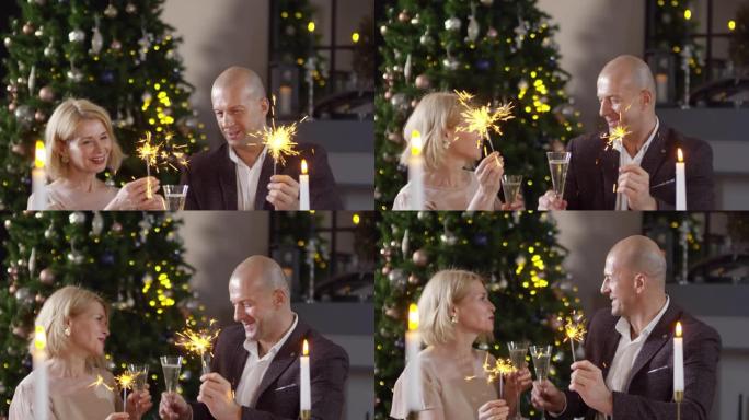 高加索夫妇用烟火和香槟祝新年快乐