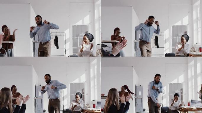 红色史诗快乐乐趣年轻的非洲经理男子在办公室做惊人的舞蹈散步庆祝职业生涯提高慢动作。