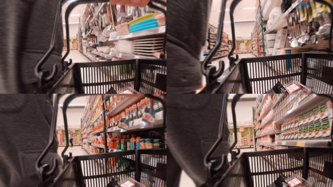 亚洲男子购物商场摄像机篮子中的低角度视图